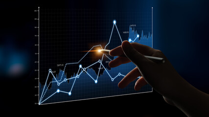 A hand holding a stylus points at a dynamic stock market graph featuring glowing data points and fluctuating trends, perfect for illustrating financial analysis concepts. Scalp