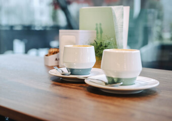Two cups of warming coffee in the morning