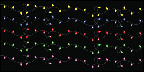 Strings of yellow blue red green and pink christmas lights on a black background decoration art