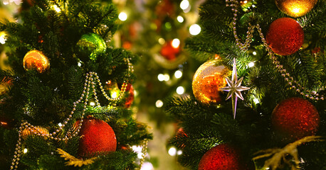 Christmas background. beautiful christmas tree with festive decor, colorful balls, glowing garlands...