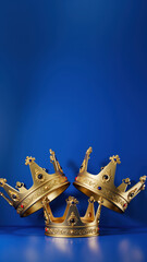 banner of Three gold crowns on blue background, symbol of Tres Reyes Magos ( Three Wise Men) who come bringing gifts for the kids on Epiphany or Dia de Reyes Magos, copy space