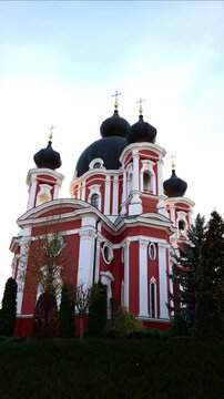 vertical Beautiful Curchi Monastery red church in Moldova