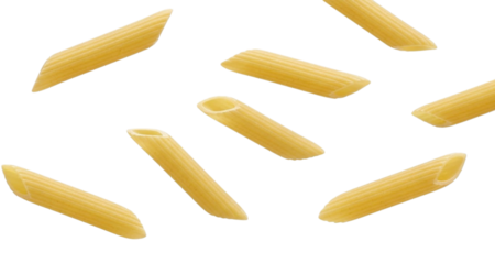Scattered penne rigate pasta tubes on a colorful striped background dry pasta food