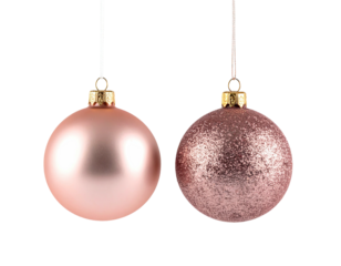Two rose-toned Christmas ornaments suspended against a black background, festive holiday decor