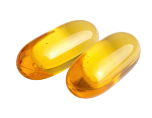 Close-up of two translucent, amber-colored gel capsules. Transparent, and reflecting light. Isolated on black