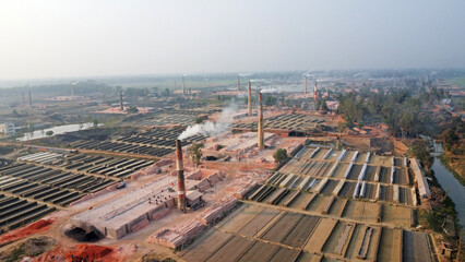 Large stacks pile of clay and red bricks in brick field which is harmful for enviornment. 