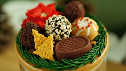 A miniature set of handmade clay cookies and chocolates in a New Year's style