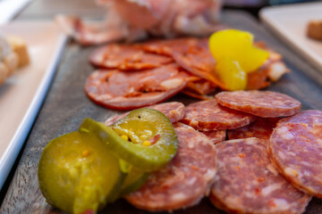 Close Up View of Sliced Salami and Pickles Illustrating Ultra Processed Food