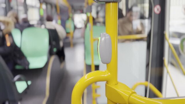 An used red stop button in a bus . Red stop button in public transportation . Stop button in the bus. Urban transportation .