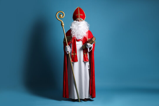 Saint Nicholas with book and crozier on blue background