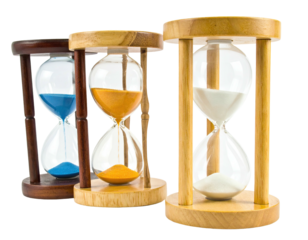 Three hourglasses with different colored sand, showcasing the concept of time