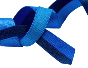 Close-up of intertwined blue ribbons, showcasing texture and color variations against a dark backdrop