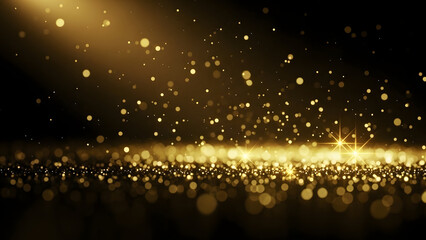 Golden glitter particles floating in dark space with a bright light shining on the surface below