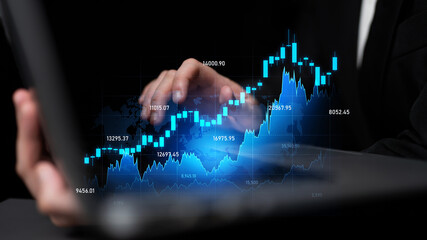 A business professional reviews dynamic financial data, represented by vivid stock market graphs, on a laptop, highlighting modern investment analysis techniques. Scalp
