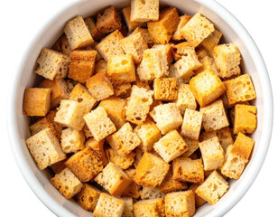 Overhead shot of a white bowl filled to the brim with small, golden-brown toasted bread cubes