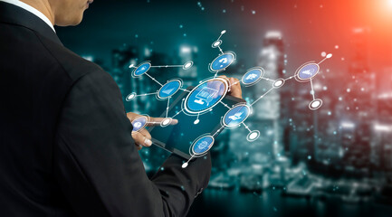 A businessman interacts with a digital tablet featuring a futuristic technology interface, symbolizing innovation and data exchange against an urban backdrop. Tessel