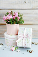 Modern Christmas pink decoration with roses, fir and baubles. Postcard motif.