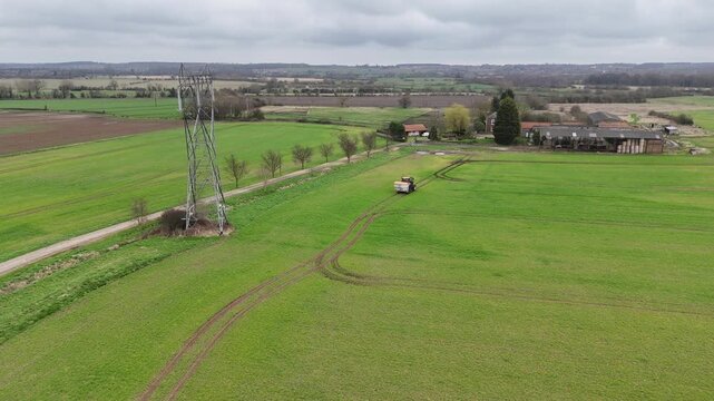 4K Drone Footage of Case IH Tractor Working on Farmland