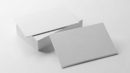 Stack of blank white business cards on a white background, ready for design