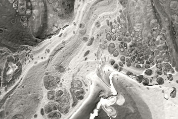 The texture of marble. Spread-out acrylic paint. Abstract background, made in the technique of fluid art. Demonstrating the colors of 2026 - Cloud Dancer.