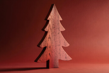 Red wooden Christmas tree decoration with blank space for text  