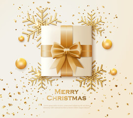 Christmas greeting card with gift box and gold snowflake decoration
