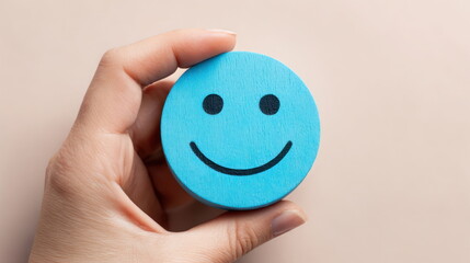 Hand holds blue smiley face wooden token against light background showing simple design and vibrant color Generative AI