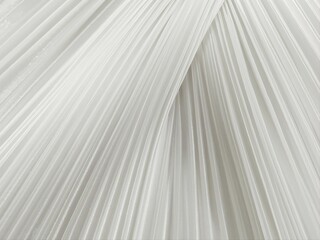 Obraz premium Elegant Cloud Dancer pleated textile in 2026 color of the year. Soft flowing fabric with delicate linear texture and dimensional folds. Perfect for luxury fashion, interior design, and branding.