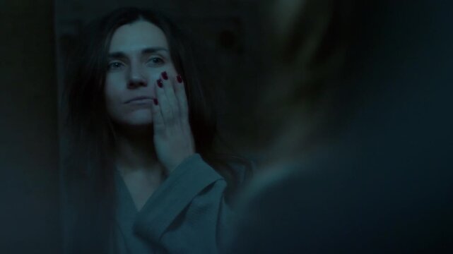 A woman stares at her reflection in the mirror, touching her face with a broken, overwhelmed expression. A cinematic moment of self-doubt, exhaustion, and emotional struggle. 