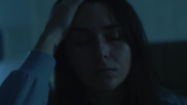 A disoriented woman touches her face, trying to steady herself before collapsing face-down onto the bed, completely exhausted. A cinematic scene symbolizing emotional overwhelm, disorientation, and