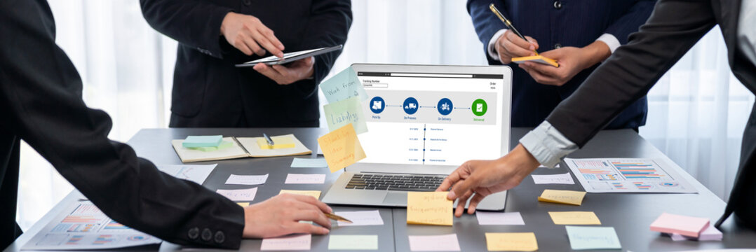 Analyst team use sticky note for creative and analytic brainstorm for business idea with BI data dashboard on laptop screen. Analysis financial data visualization tech for marketing strategy. Prodigy - Powered by Adobe