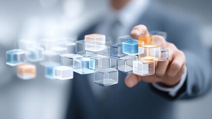 Visionary Touch: A suited individual, in a moment of technological exploration, gently interacts with a series of digital cubes. The image suggests technological innovation, business development.