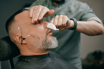 Modern barbershop experience for adult caucasian men with beard grooming, ear and nose hair removal waxing