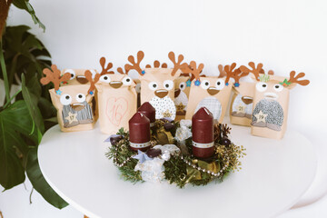 Christmas Advent wreath and Advent calendar with gifts