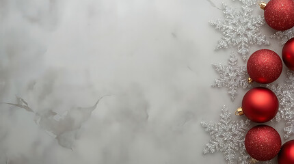 Elegant festive background for holiday season marketing with red ornaments and silver snowflakes on a marble surface, perfect for winter promotions