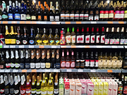 Different alcoholic products on a supermarket shelves