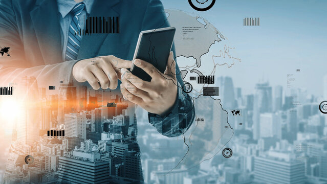 A business professional interacts with a smartphone against a city skyline backdrop, enhanced by data visualization graphics, illustrating modern communication and technology use. Xenic - Powered by Adobe