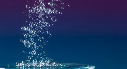 Clear bubbles rising from water surface against dark gradient background, showcasing effervescence and freshness, ideal for beverage concept