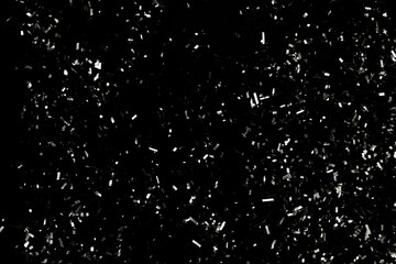 Blurry garland lights on a dark background. Festive Christmas and New Year background. Soft focus. Image toned in color of the year 2026 - Cloud Dancer.