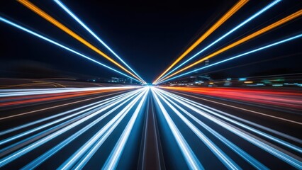 Vibrant blue and orange light trails streak across a dark highway at high speed