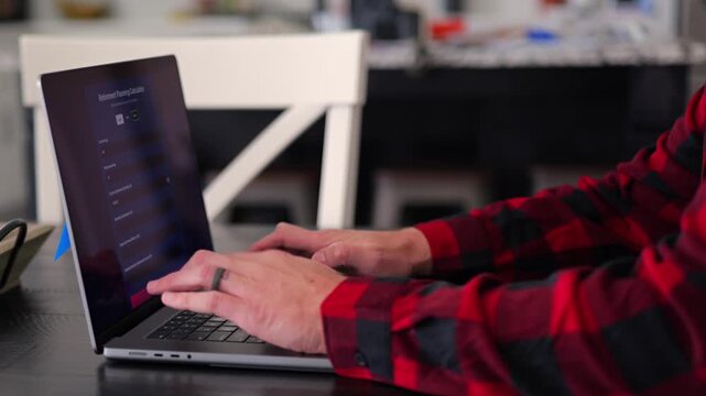 Middle Aged Man Using Retirement Calculator App at Kitchen Table Finding Savings Underestimated Funds Required to Financially Survive Concept