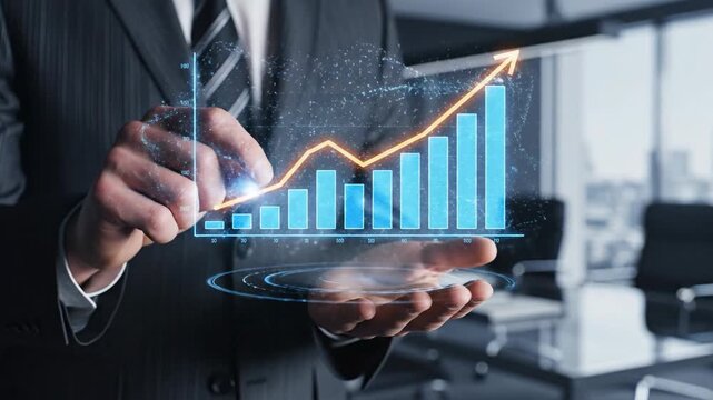 Business professional hand holding holographic growing bar chart representing financial success and data analysis