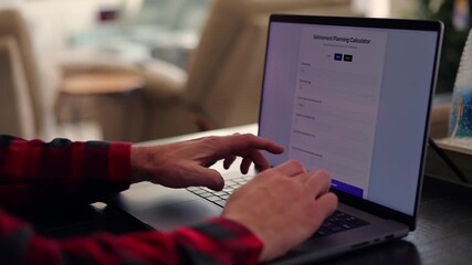 Middle Aged Man Using Retirement Calculator App at Kitchen Table Finding Savings Underestimated Funds Required to Financially Survive Concept