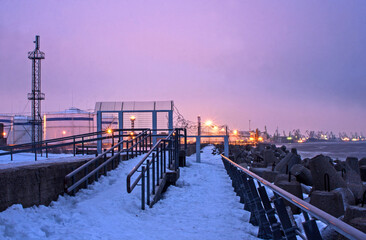 A seaport on a late winter evening. The Port of Klaipeda, Lithuania, viewed from the Northern Breakwater.