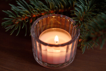 Little christmas candle in glass candlestick holder