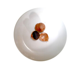 Top view of garlic single clove heated for two weeks until it turns black (Herbal medicine) isolated on transparent background.