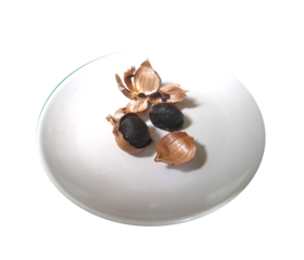 Isometric view of garlic single clove heated for two weeks until it turns black (Herbal medicine) isolated on transparent background.