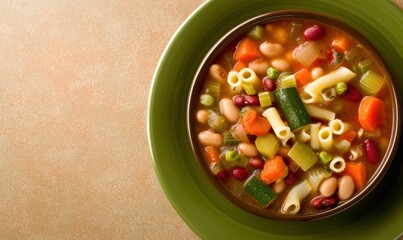 Bowl of Minestrone Soup With Pasta and Vegetables Served on Green Plate for Healthy Lunch