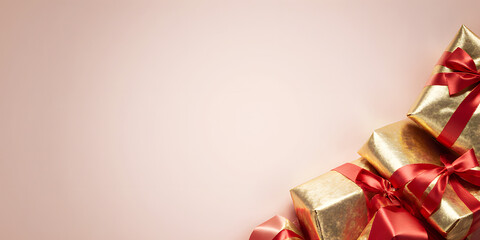 Golden Shiny Gift Box with Pink Ribbon: Holiday Celebration and Joyful Festive Decor
