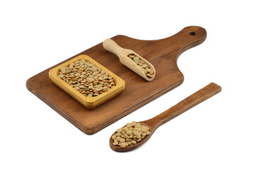 Green lentils in wooden bowl on isolated white background. Top view, copy space. Flat lay. (real photo. NOT artificial intelligence generated.)